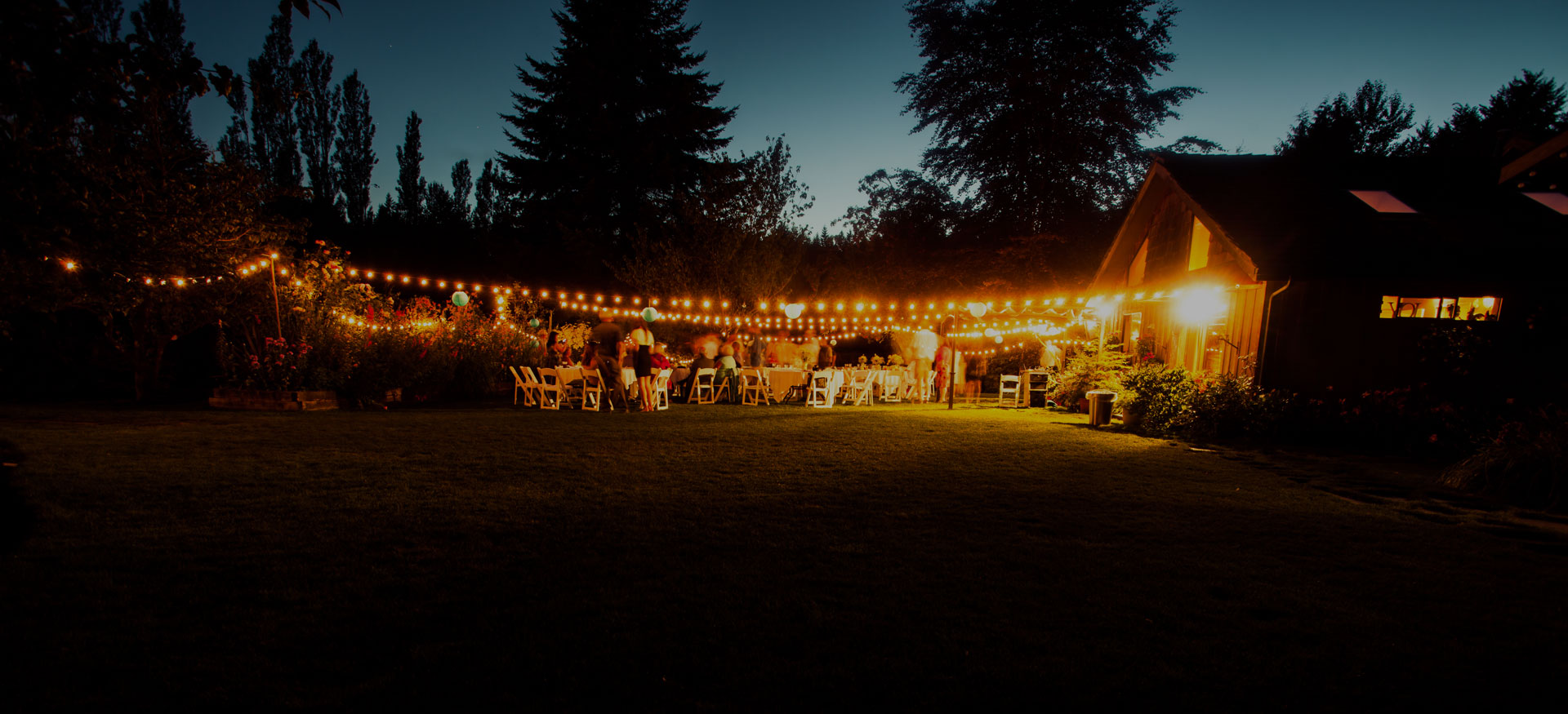 Outdoor wedding reception with fairy lights